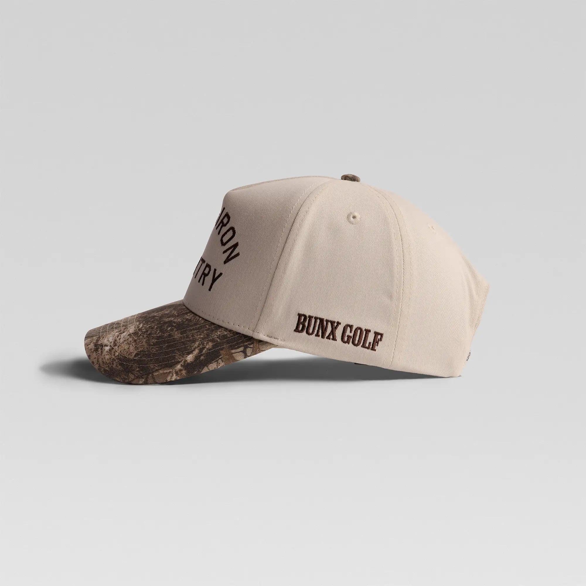 BUNX Golf Long Iron Country natural and camo snapback, left side view with BUNX Golf embroidery
