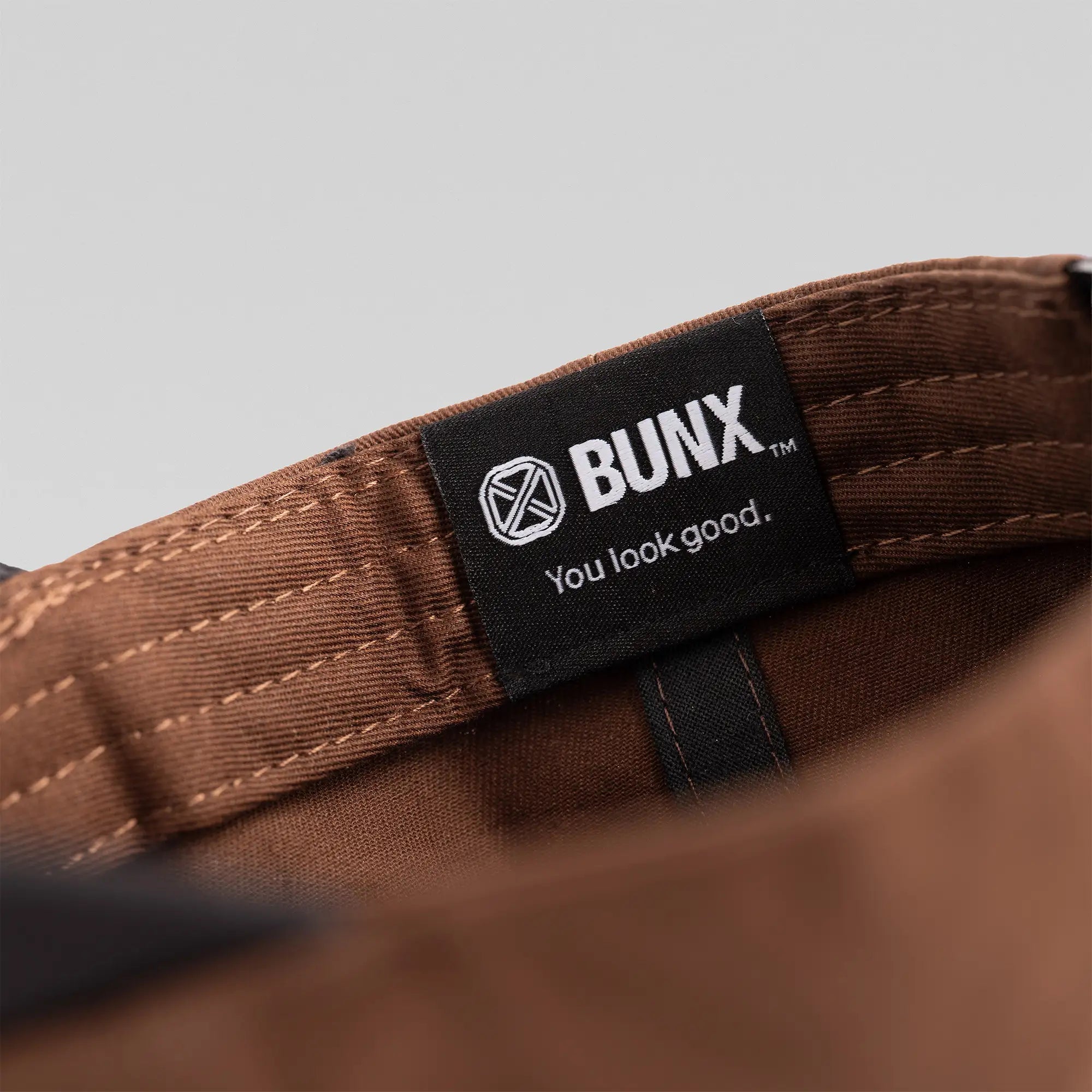 BUNX Golf Long Iron Country brown snapback interior with BUNX You Look Good label