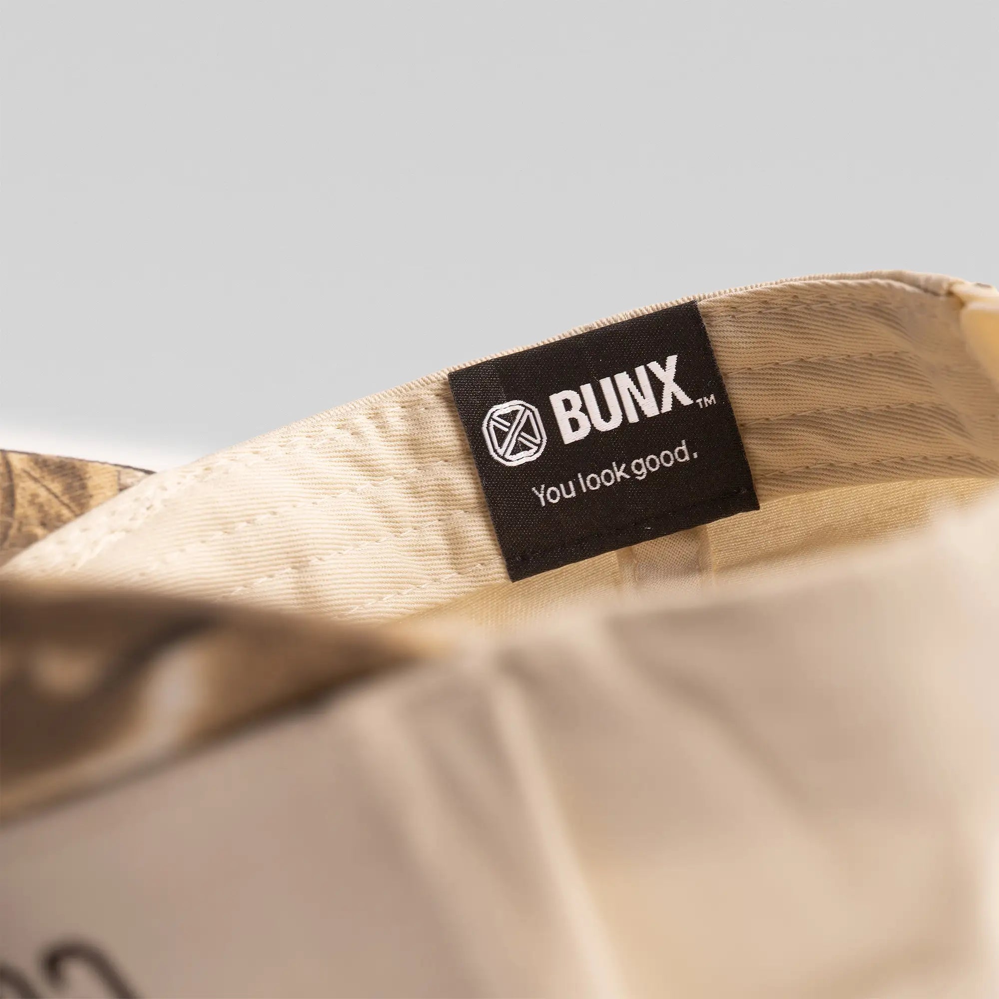 BUNX Golf Long Iron Country natural snapback interior with BUNX You Look Good label