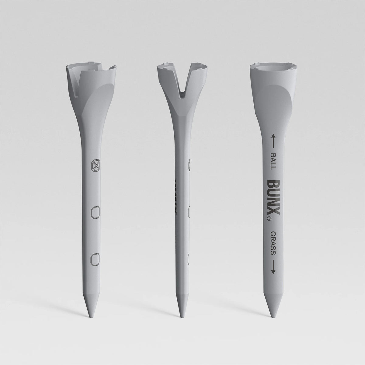 BUNX Golf V-01 performance tees showing V-slot head and dimpled design